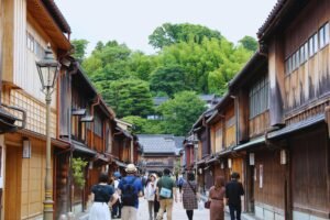 Explore the charming historic streets of Kanazawa, Japan, with traditional wooden houses.